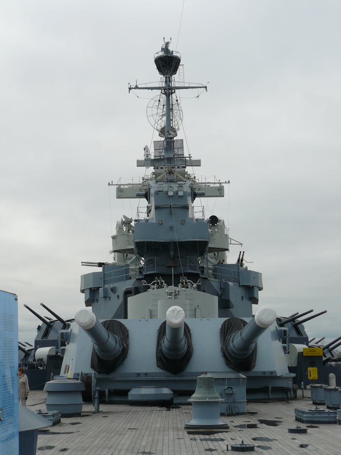 Home Front view of the historic USS North Carolina battleship in Wilmington, NC under overcast sky.
